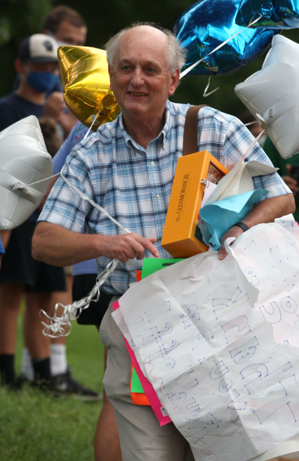 Rudloff walks home carrying balloons